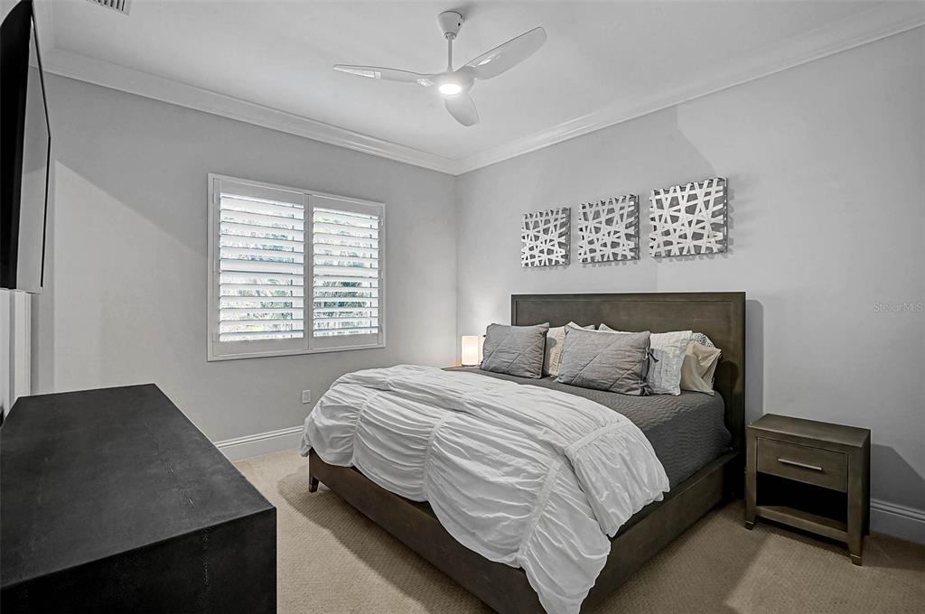 101 Seagull Lane Sarasota, FL 34236 - Photo 25 of 90 a bedroom with a bed and a desk