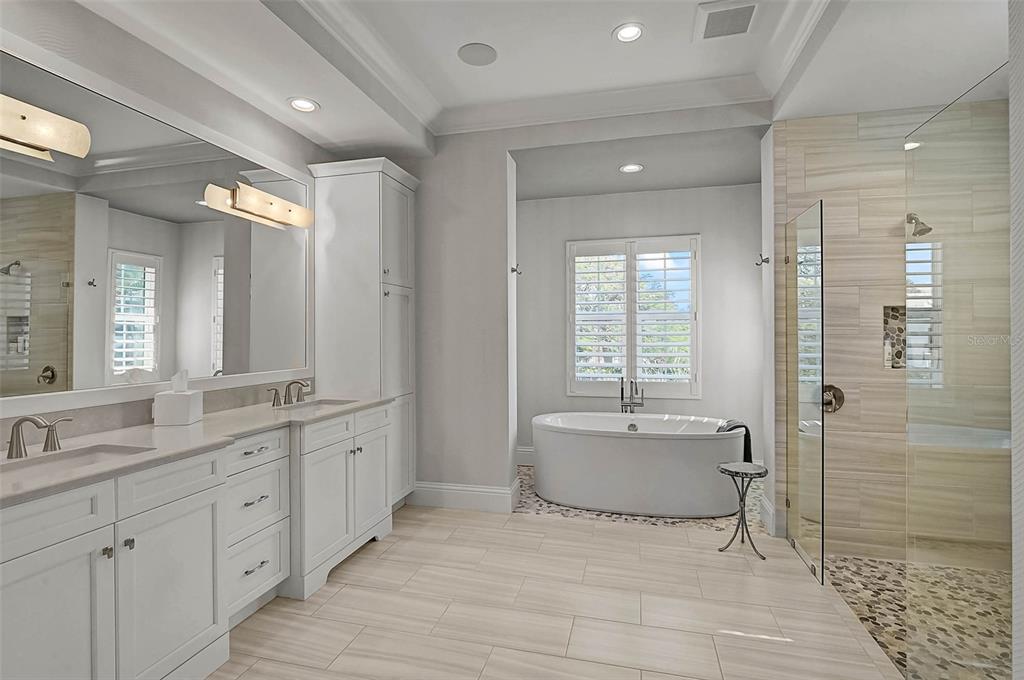 101 Seagull Lane Sarasota, FL 34236 - Photo 32 of 90 a spacious bathroom with a double vanity sink mirror and shower