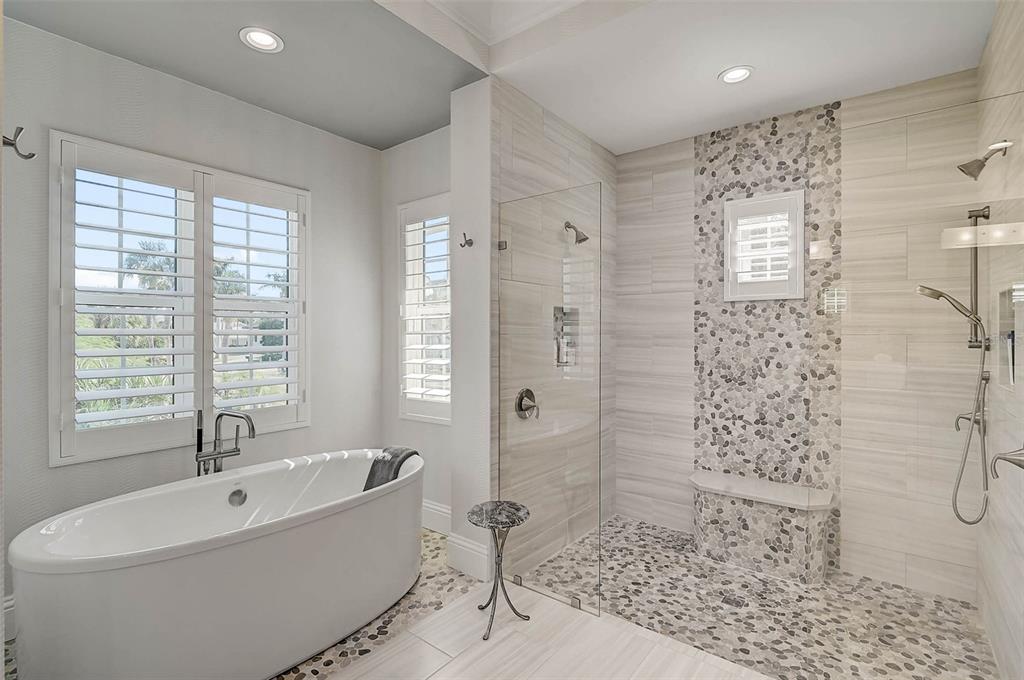 101 Seagull Lane Sarasota, FL 34236 - Photo 35 of 90 a bathroom with a bathtub and shower