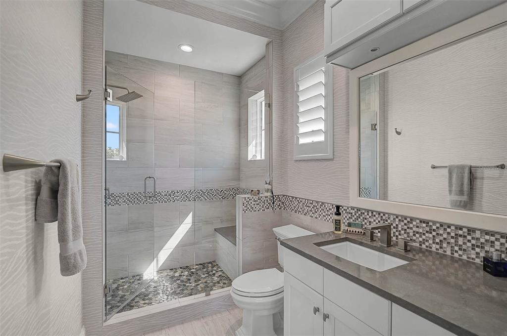101 Seagull Lane Sarasota, FL 34236 - Photo 49 of 90 a bathroom with a granite countertop sink toilet and shower