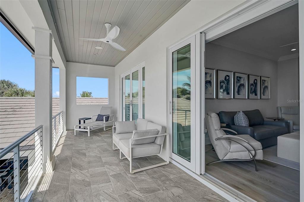 101 Seagull Lane Sarasota, FL 34236 - Photo 50 of 90 a living room with furniture and a fireplace