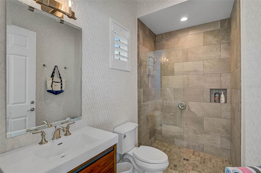101 Seagull Lane Sarasota, FL 34236 - Photo 55 of 90 a bathroom with a sink a toilet and shower