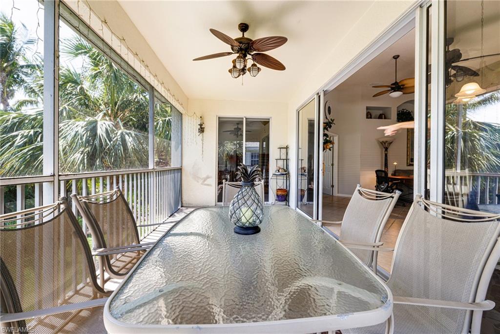 19081 Ridgepoint Drive, Unit 201 Estero, FL 33928 - Photo 26 of 42 a dining room with furniture a chandelier and wooden floor
