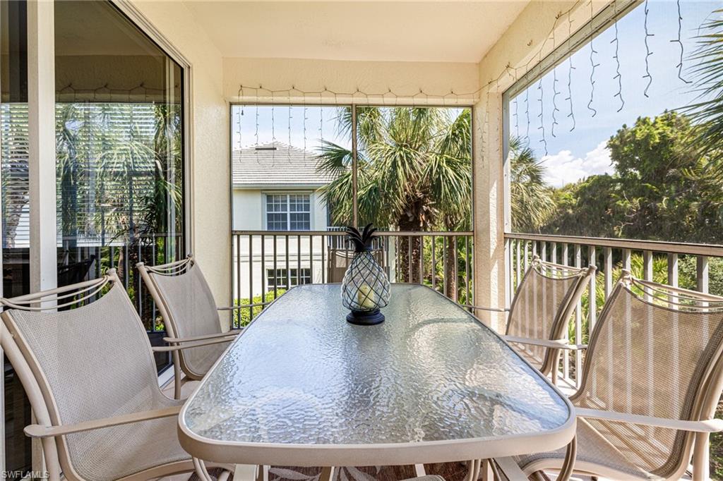 19081 Ridgepoint Drive, Unit 201 Estero, FL 33928 - Photo 27 of 42 a view of a dining room with furniture wooden floor and potted plants