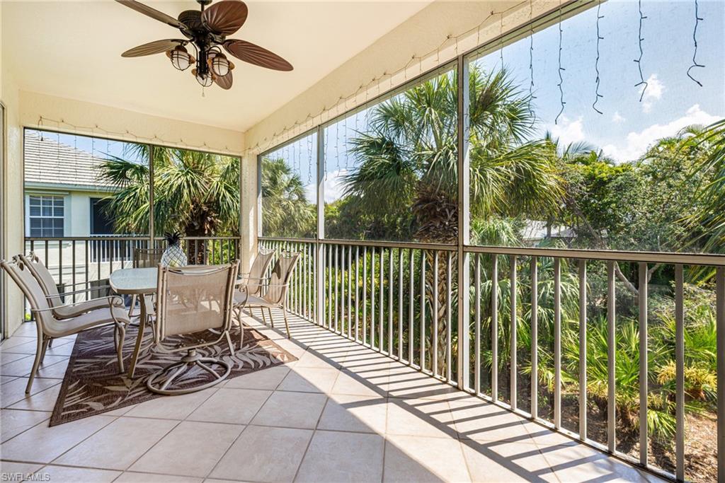 19081 Ridgepoint Drive, Unit 201 Estero, FL 33928 - Photo 28 of 42 a view of a chairs and table in patio