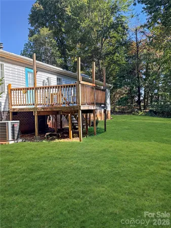a view of a house with a backyard