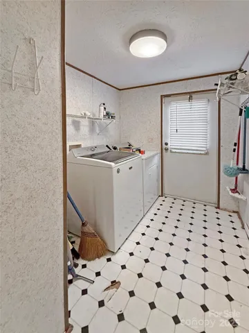 a kitchen with a sink a stove and cabinets