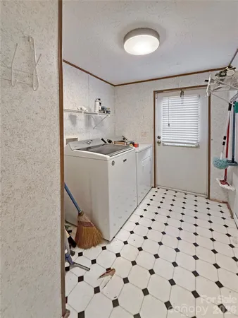 a kitchen with a sink a stove and cabinets