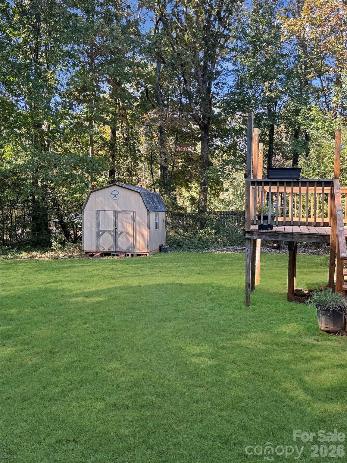 121 Haystack Lane Olin, NC 28660 - Photo 2 of 23 a view of a house with backyard and a tree
