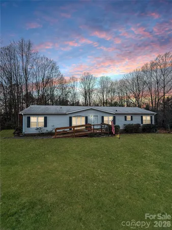 a view of a house with a big yard
