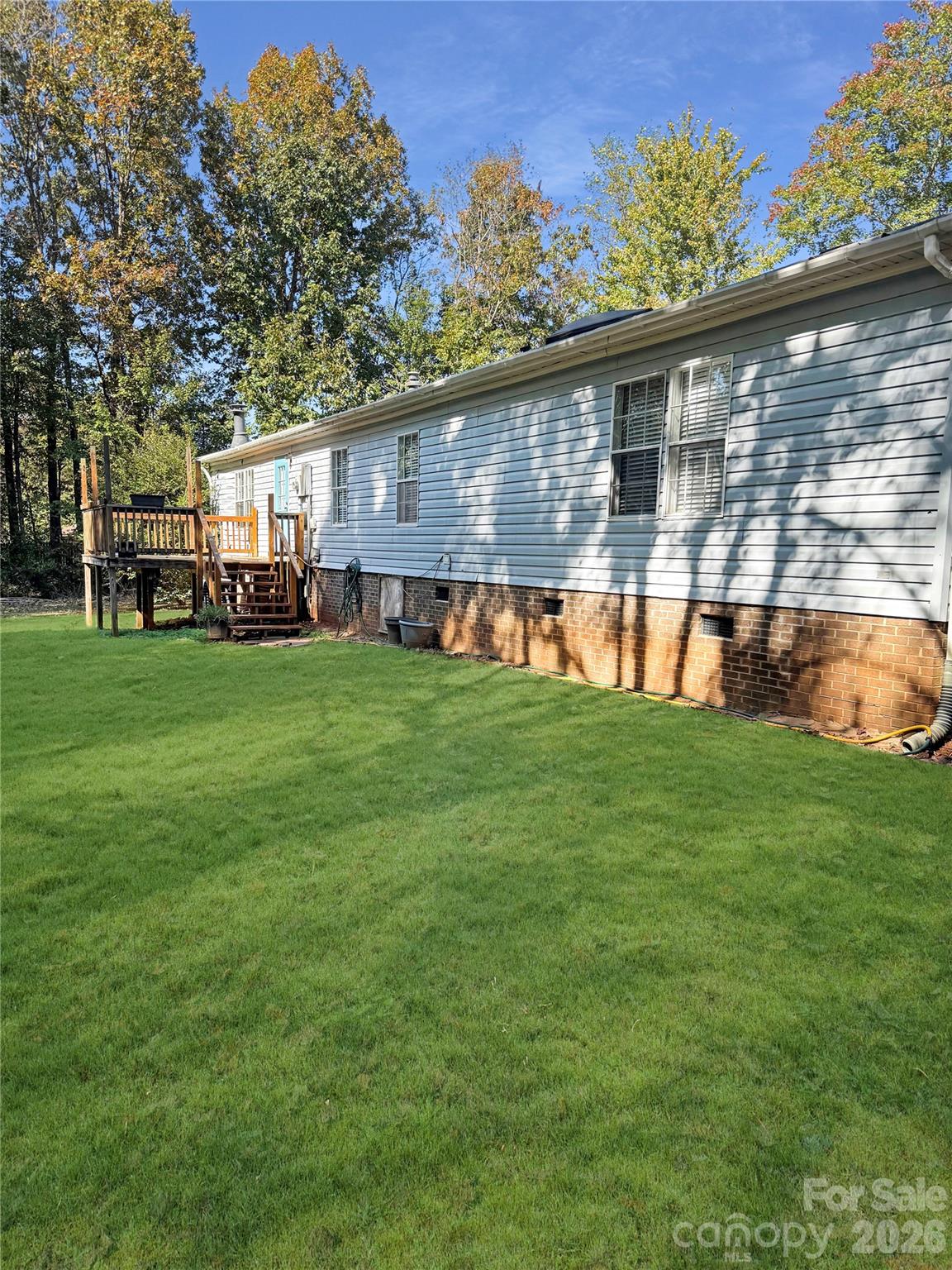 121 Haystack Lane Olin, NC 28660 - Photo 5 of 23 a view of a house with a backyard