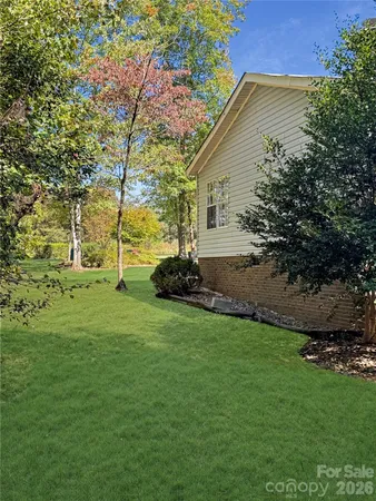 a backyard of a house with lots of green space