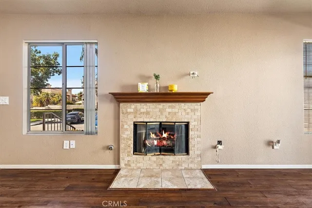 a living room with a fireplace and a window
