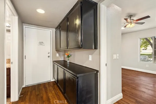 a kitchen with a sink and wooden cabinets