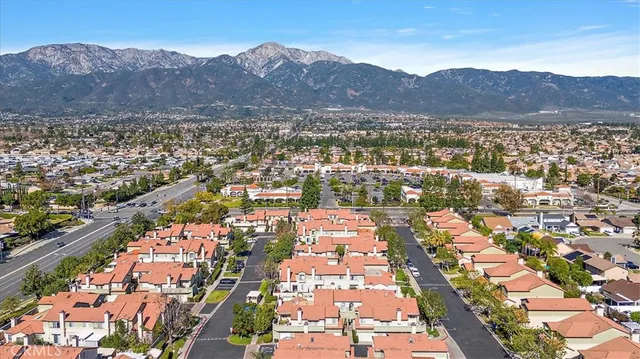 an aerial view of residential houses and city view