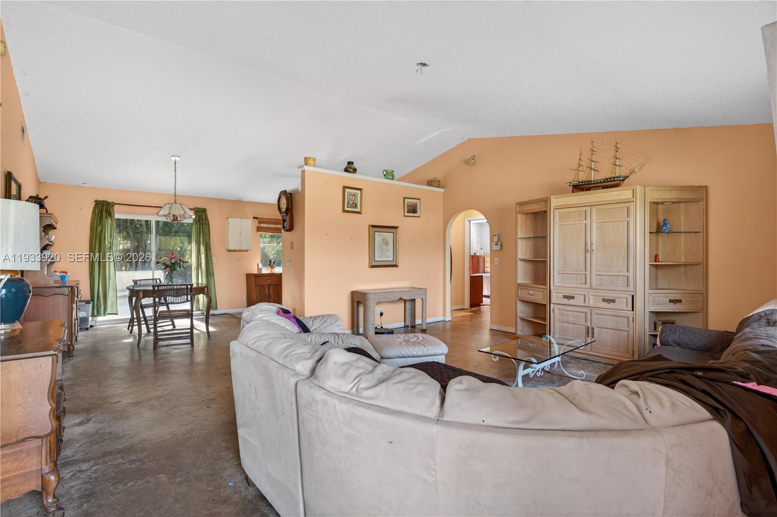 13228 158th Street North Jupiter, FL 33478 - Photo 2 of 21 a living room with furniture and a large window