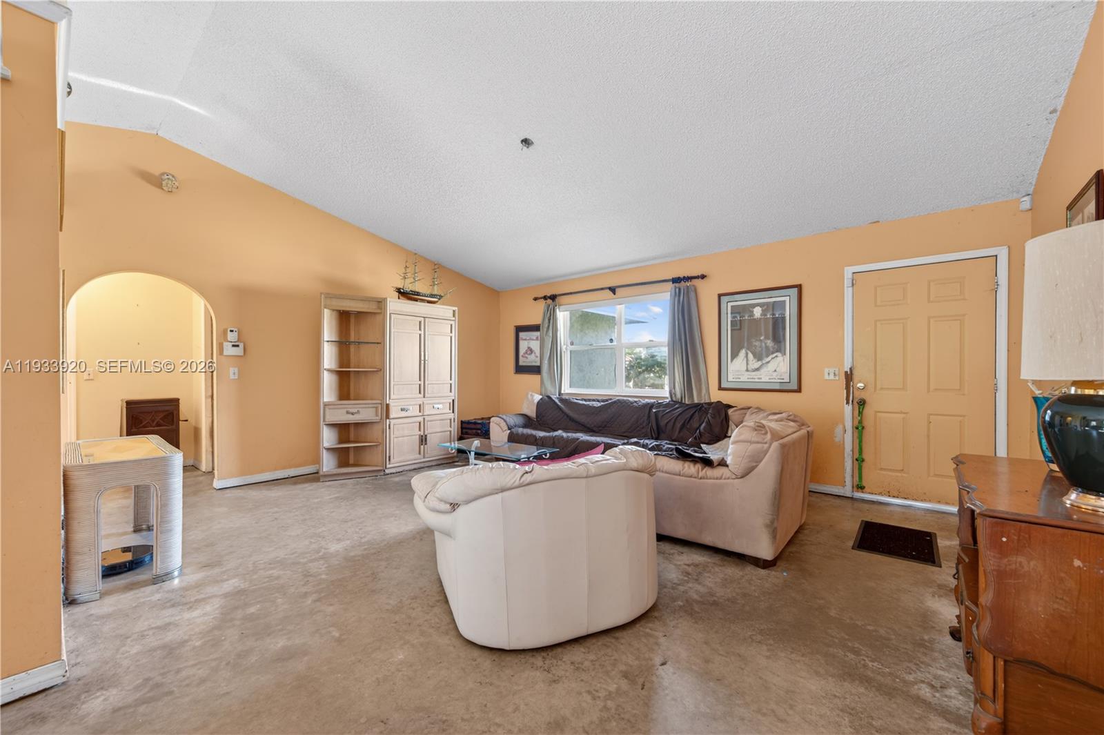 13228 158th Street North Jupiter, FL 33478 - Photo 3 of 21 a living room with furniture and a window