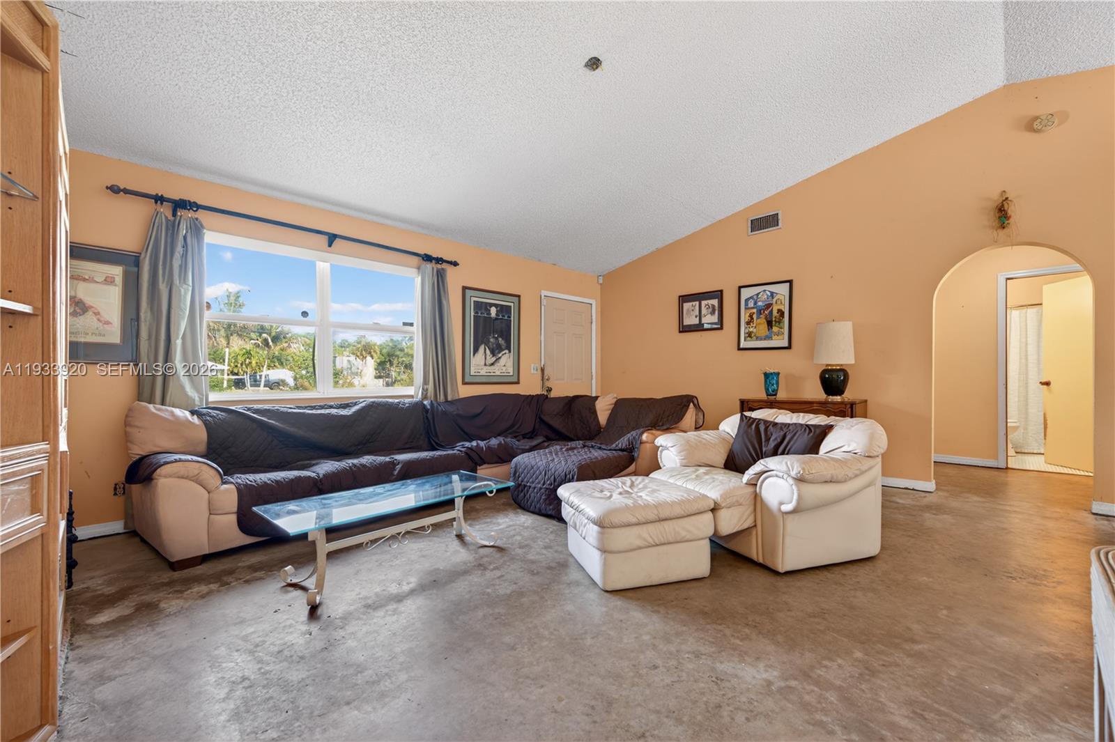 13228 158th Street North Jupiter, FL 33478 - Photo 4 of 21 a living room with furniture and a large window