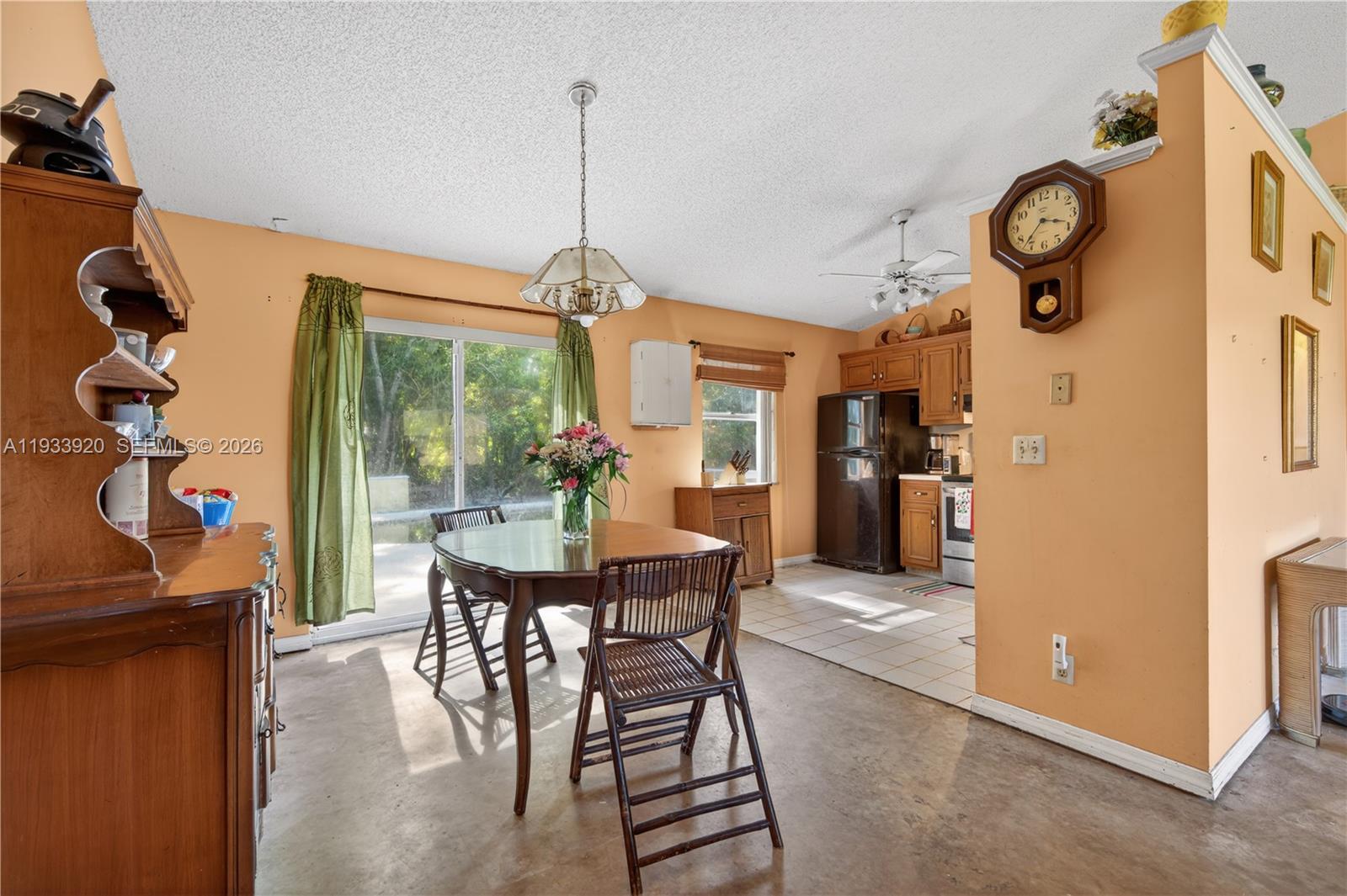 13228 158th Street North Jupiter, FL 33478 - Photo 6 of 21 a view of a dining room with furniture window and wooden floor