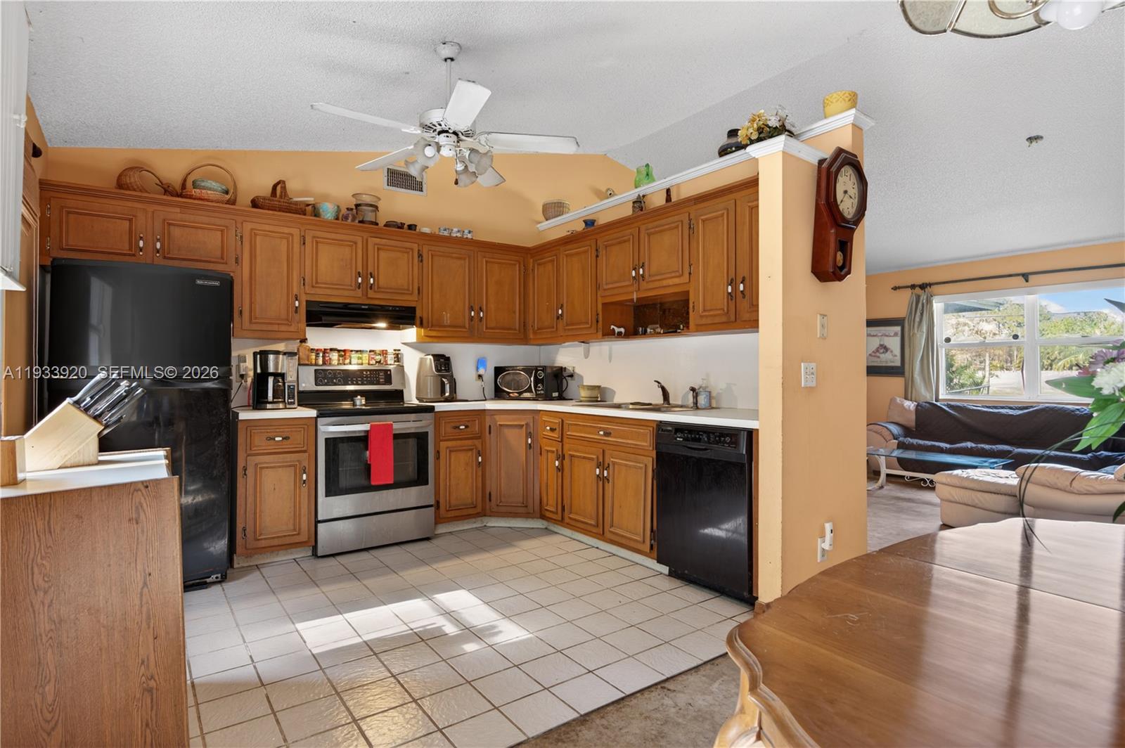 13228 158th Street North Jupiter, FL 33478 - Photo 7 of 21 a kitchen with a refrigerator sink and stove