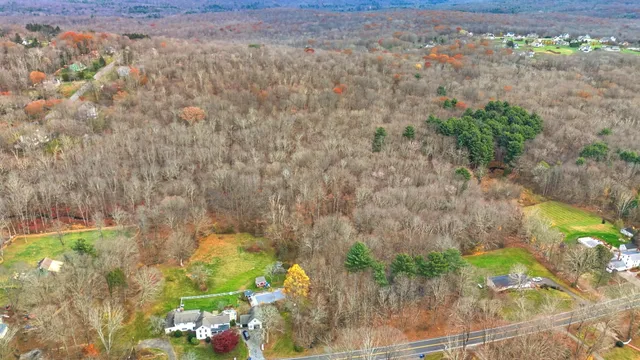 an aerial view of mountain with trees around
