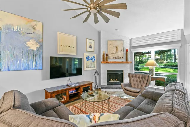 a living room with furniture fireplace and a flat screen tv