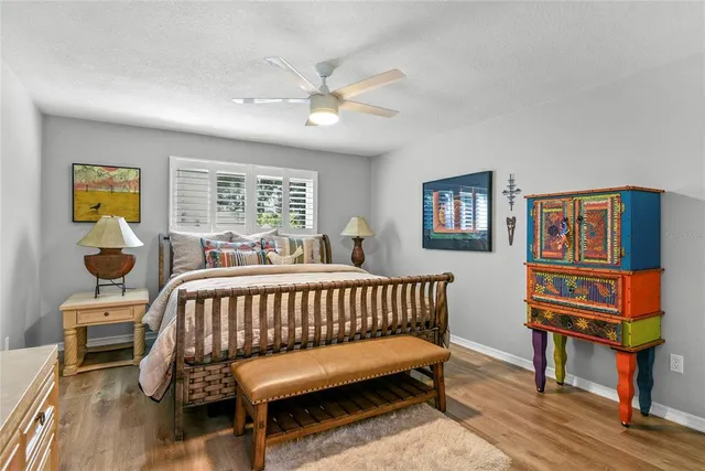 a bedroom with furniture and a window