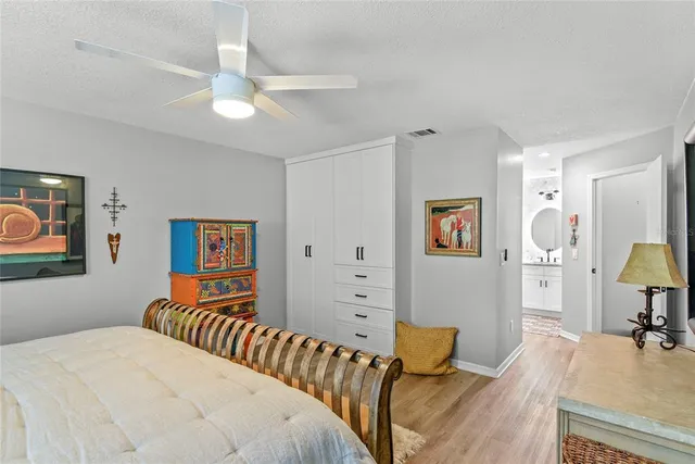 a bedroom with a bed and dresser