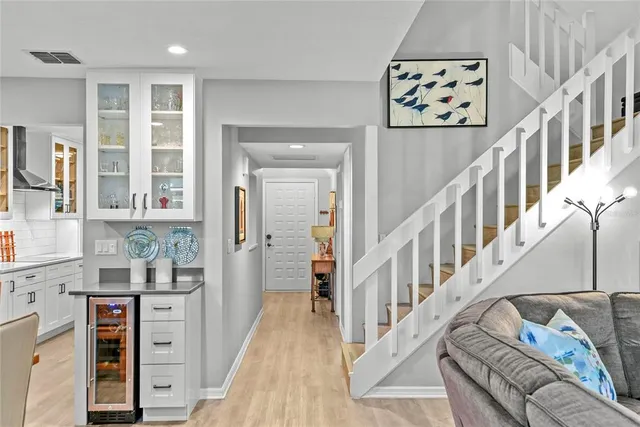 a view of an entryway with wooden floor and windows