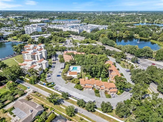 an aerial view of residential houses with outdoor space