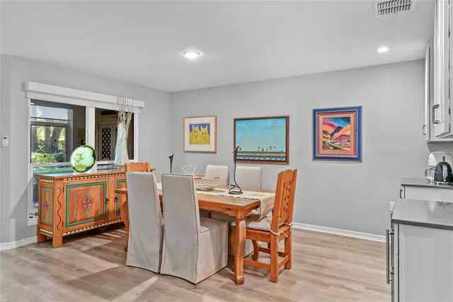 a dining room with furniture and window