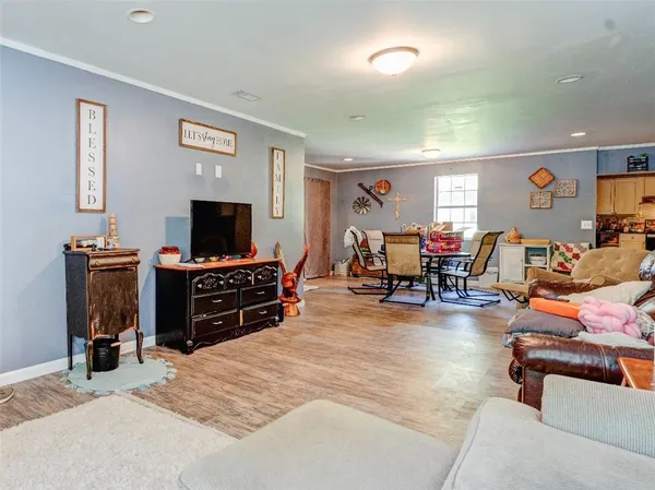 a room with furniture and a flat screen tv