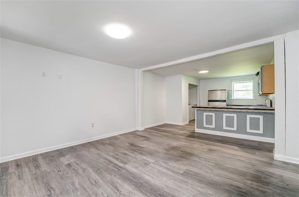 4494 Old Summerville Road Armuchee, GA 30105 - Photo 16 of 16 a view of kitchen and hall with wooden floor