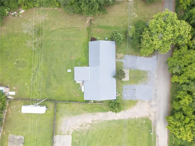 an aerial view of a house with a garden