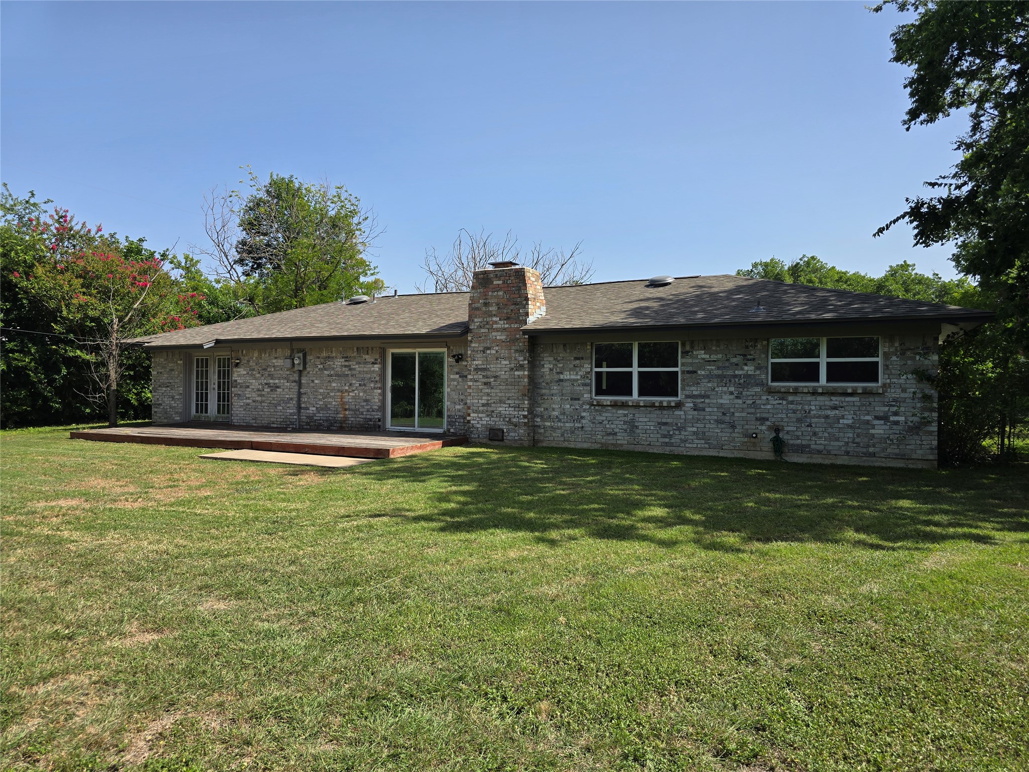 205 East Cherokee Drive Harker Heights, TX 76548 - Photo 22 of 23 A spacious backyard with an inviting wooden deck, perfect for outdoor enjoyment.
