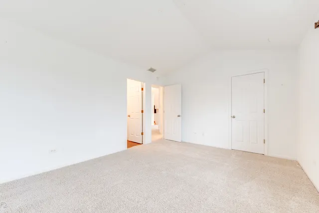 a bathroom with a granite countertop sink toilet a large mirror a vanity and shower