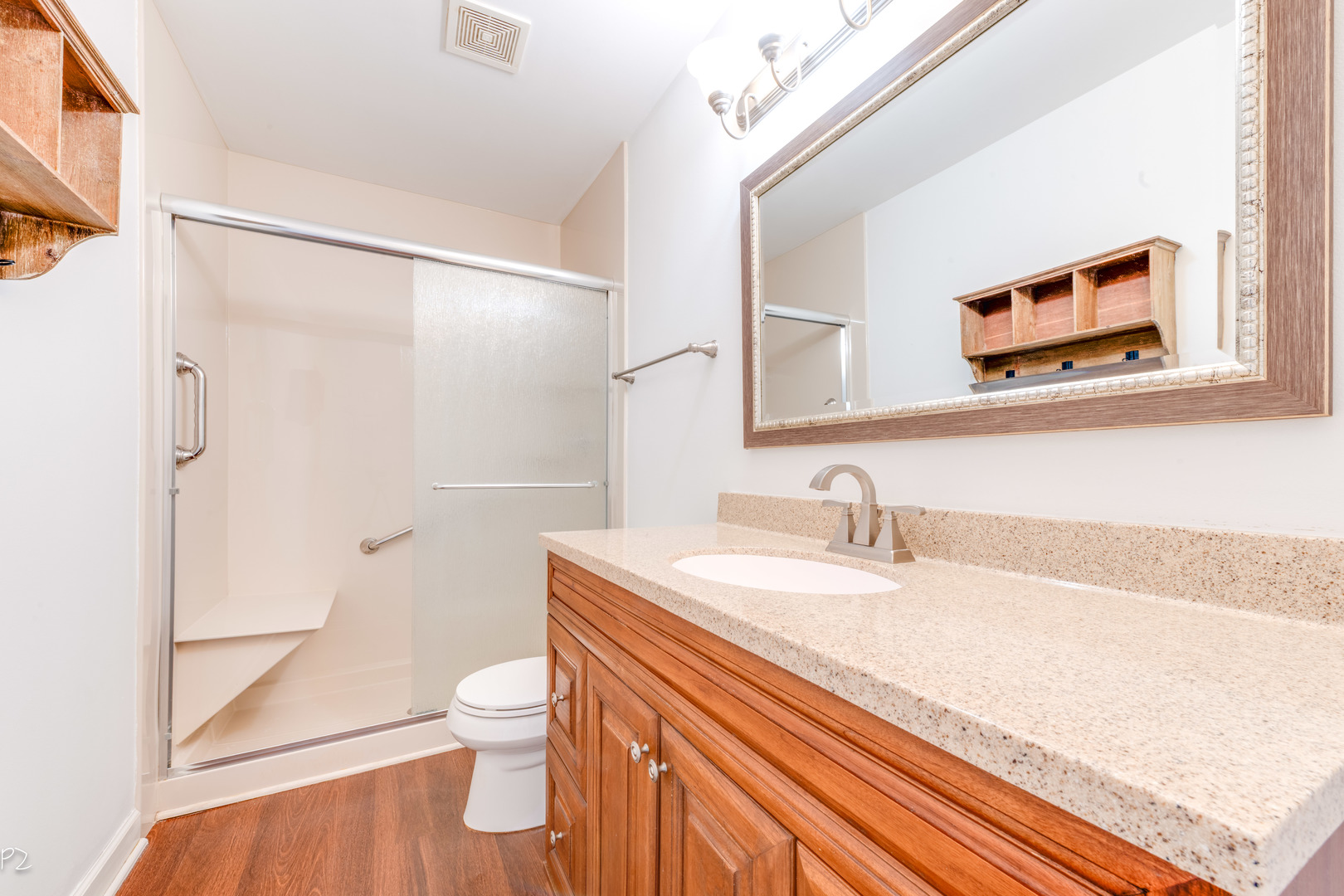 24181 Pear Tree Circle Plainfield, IL 60585 - Photo 17 of 25 a bathroom with a granite countertop sink toilet a large mirror a vanity and shower