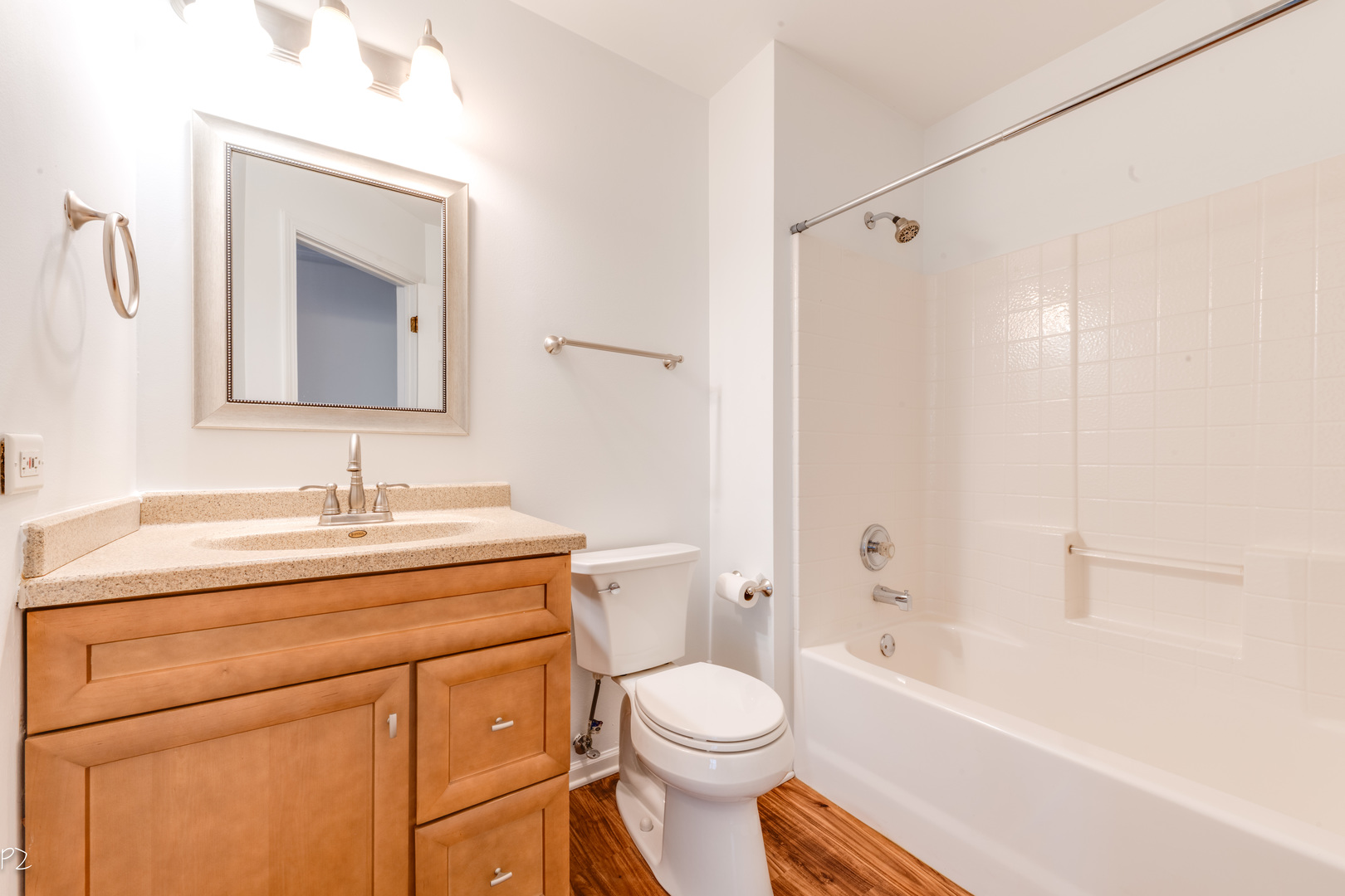 24181 Pear Tree Circle Plainfield, IL 60585 - Photo 20 of 25 a bathroom with a sink toilet vanity and shower