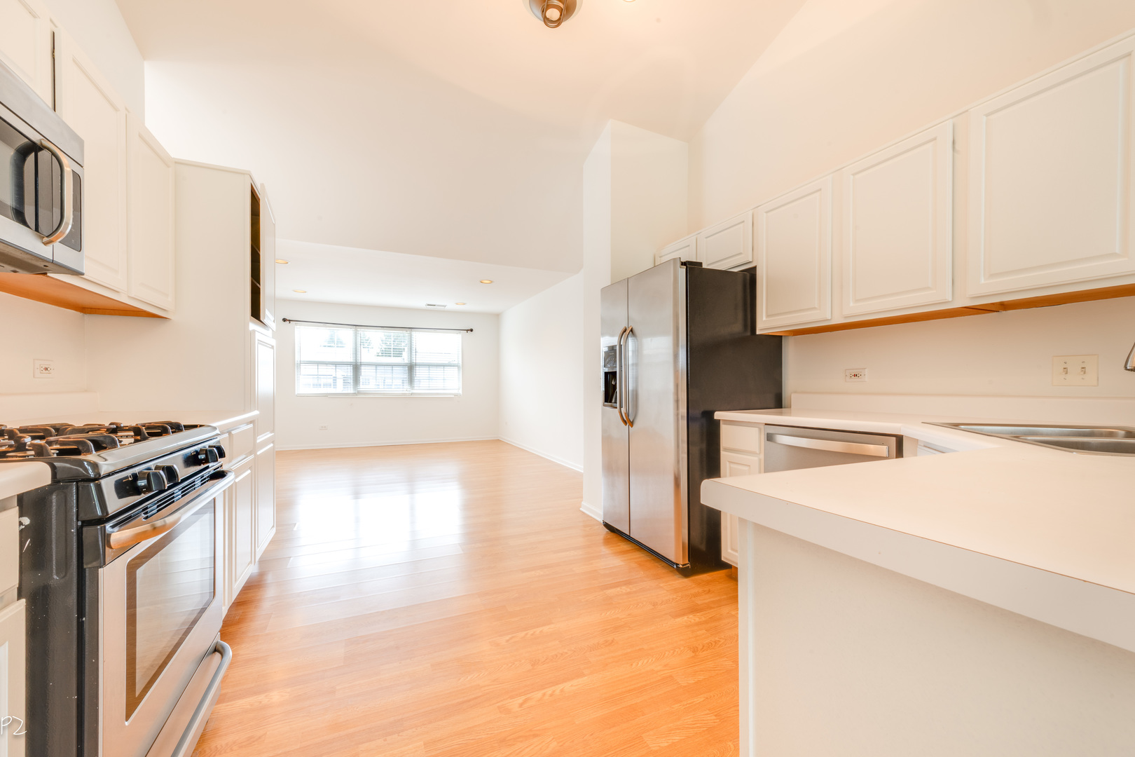 24181 Pear Tree Circle Plainfield, IL 60585 - Photo 6 of 25 a kitchen with a stove a refrigerator and a stove