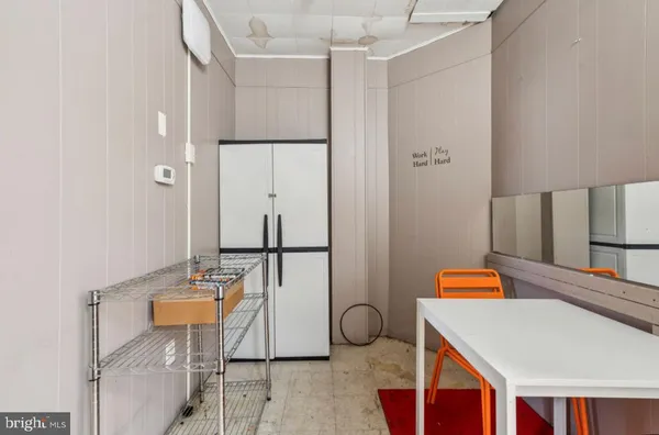 a room with table and chairs