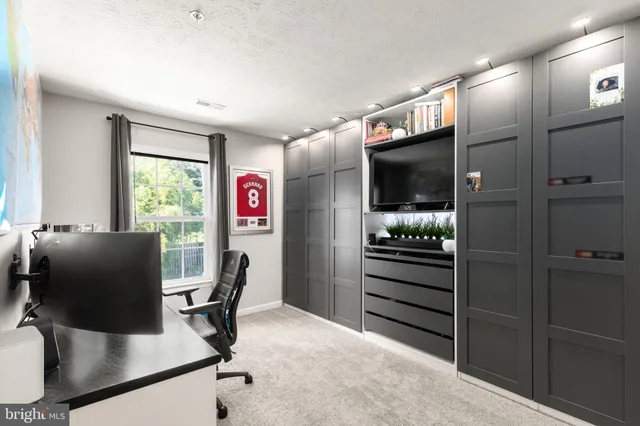 a view of a workspace with furniture