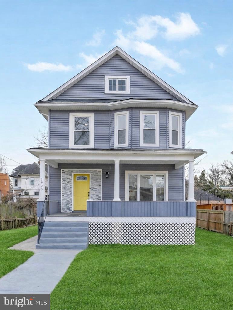 3925 Norfolk Avenue Baltimore, MD 21216 - Photo 2 of 49 a front view of a house with a yard and outdoor seating
