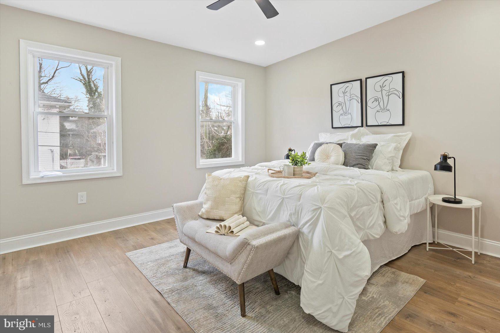 3925 Norfolk Avenue Baltimore, MD 21216 - Photo 21 of 49 a bedroom with a bed and wooden floor