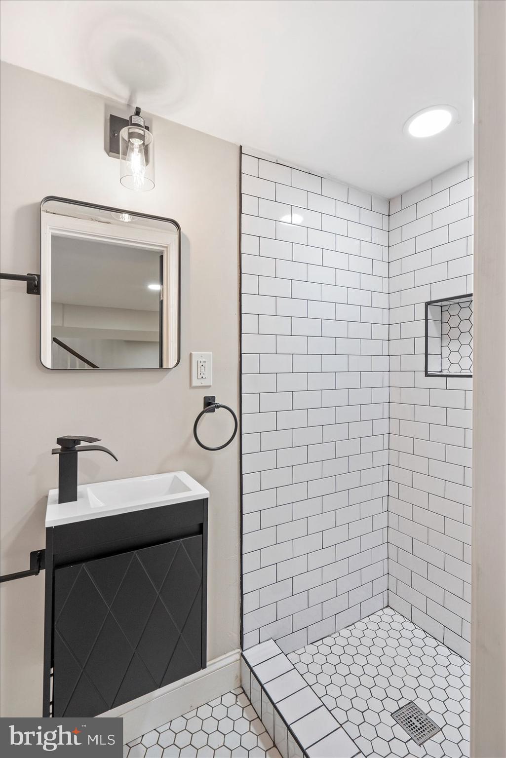 3925 Norfolk Avenue Baltimore, MD 21216 - Photo 40 of 49 a bathroom with a sink toilet and shower