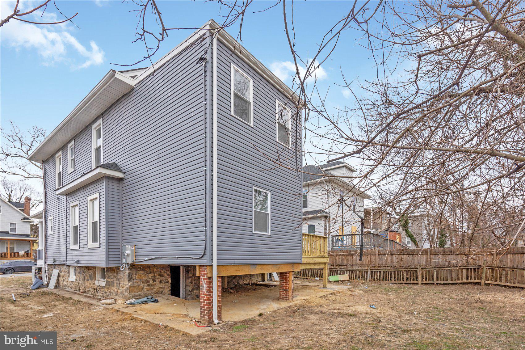 3925 Norfolk Avenue Baltimore, MD 21216 - Photo 45 of 49 a view of a house with a yard and wooden fence