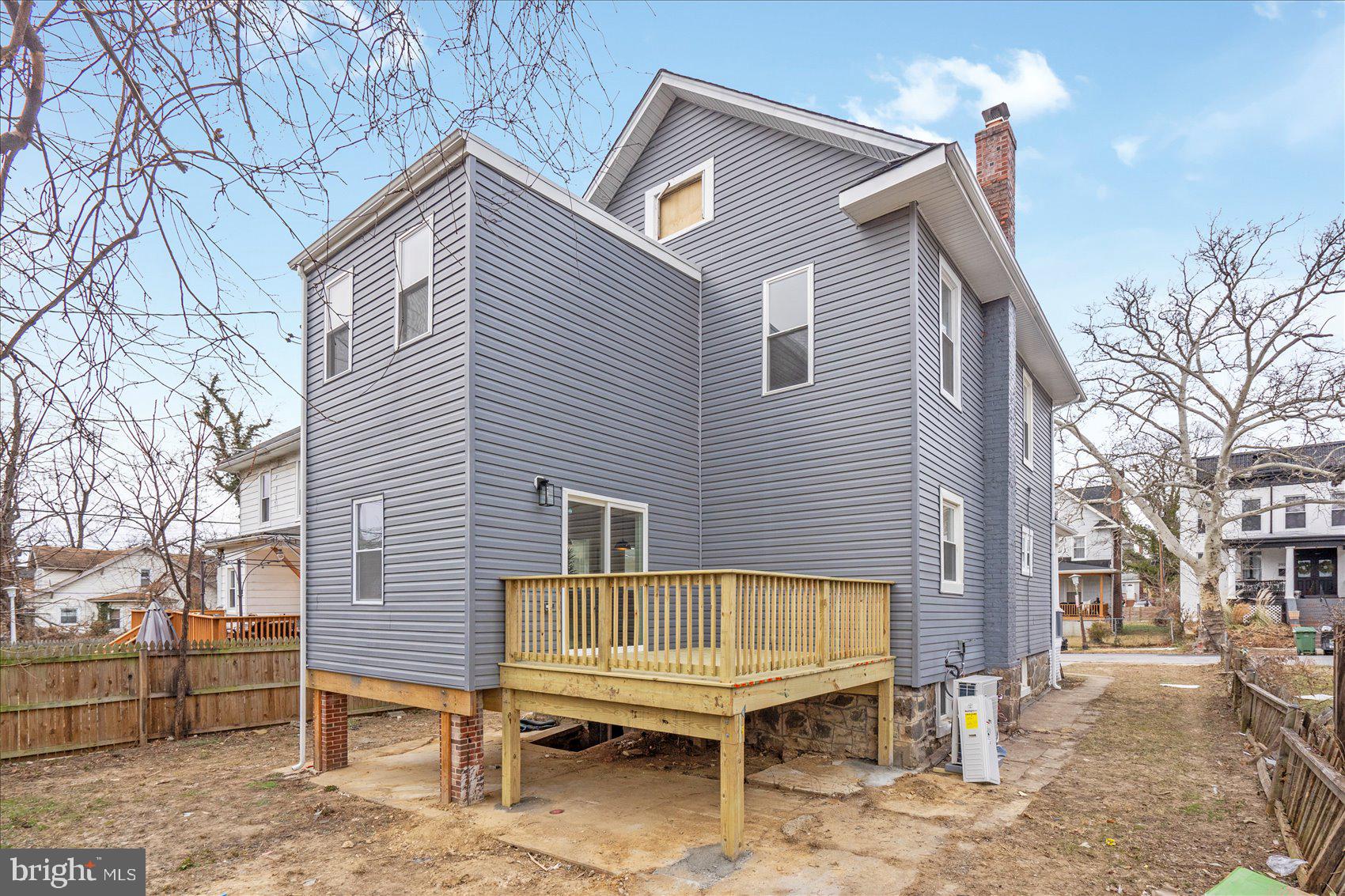 3925 Norfolk Avenue Baltimore, MD 21216 - Photo 46 of 49 a small white building with a white roof and table and chairs