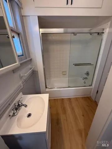 a bathroom with a sink and shower