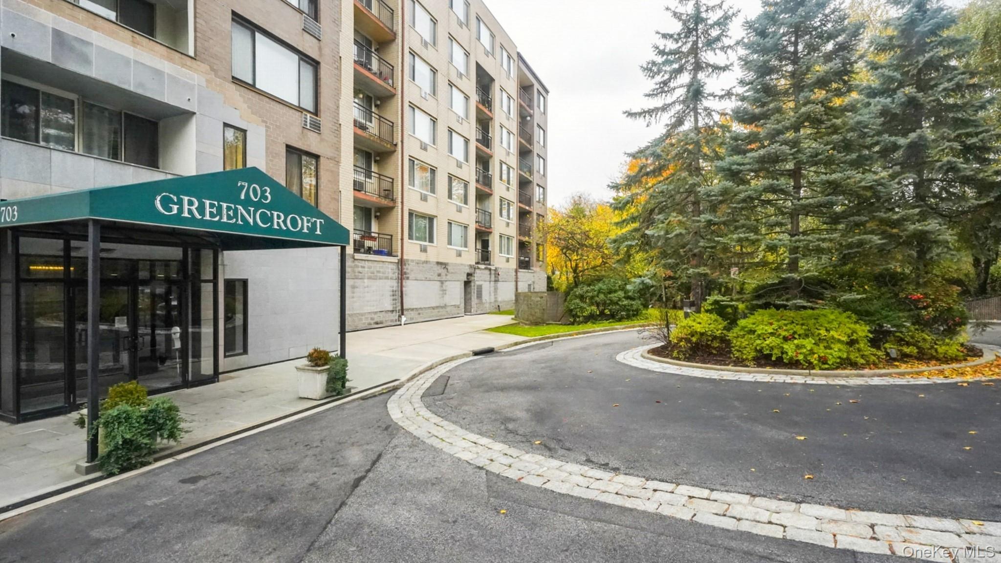 a view of a building with a yard