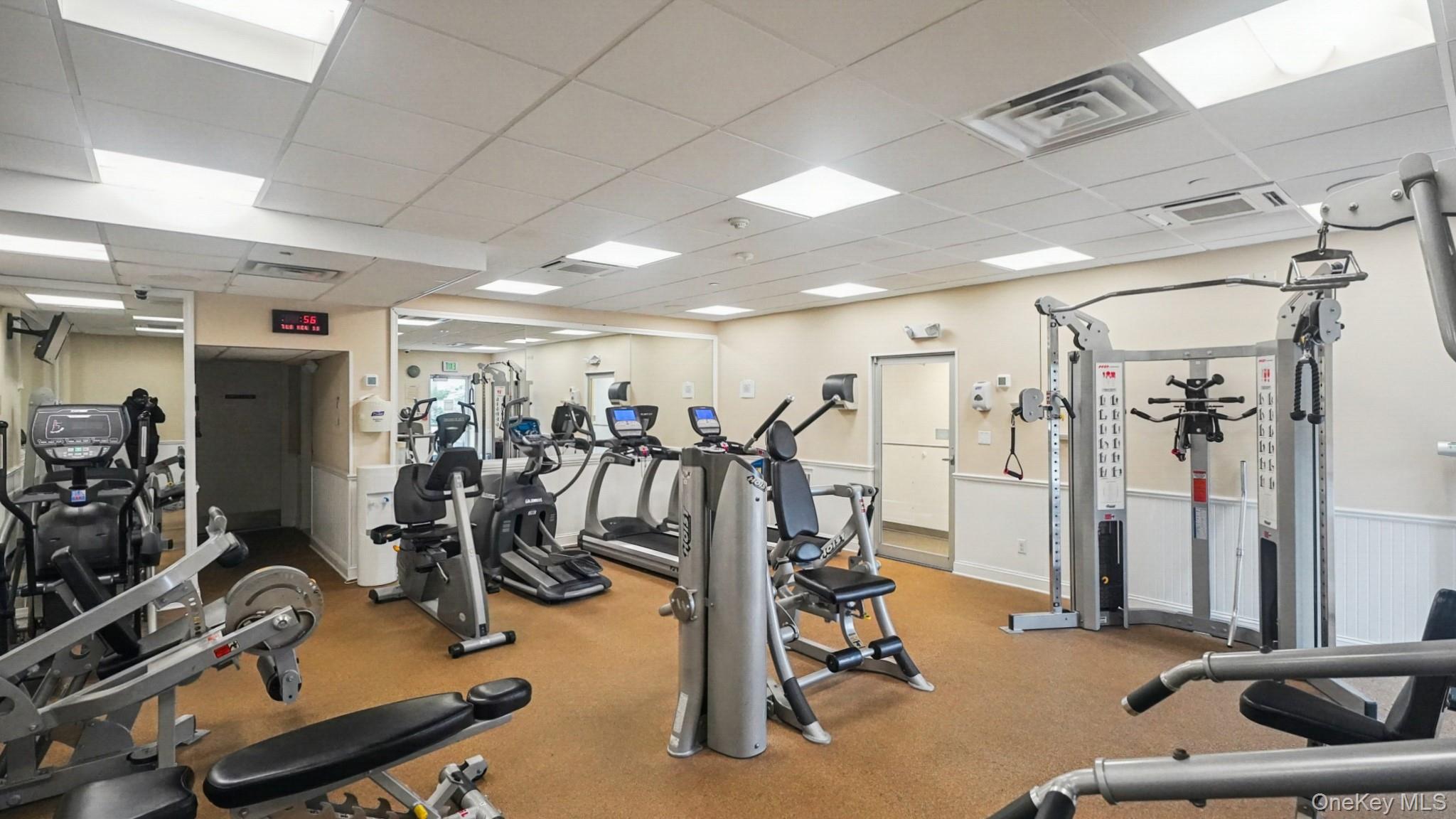 703 Pelham Road, Unit 107 New Rochelle, NY 10805 - Photo 12 of 14 a view of a room with gym equipment