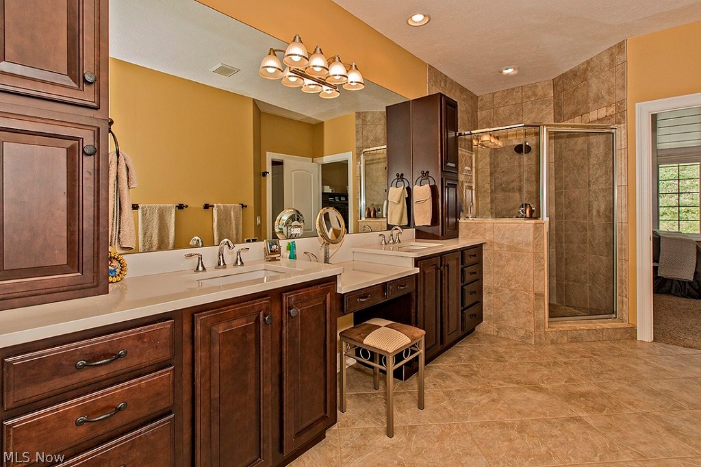 3375 Legends Way Cleveland, OH 44124 - Photo 19 of 33 Glamour Bathroom with Double Vanity with Custom Cabinetry and Granite Counter Top, Ceramic Tile Flooring, Jacuzzi Tub and Oversized Shower